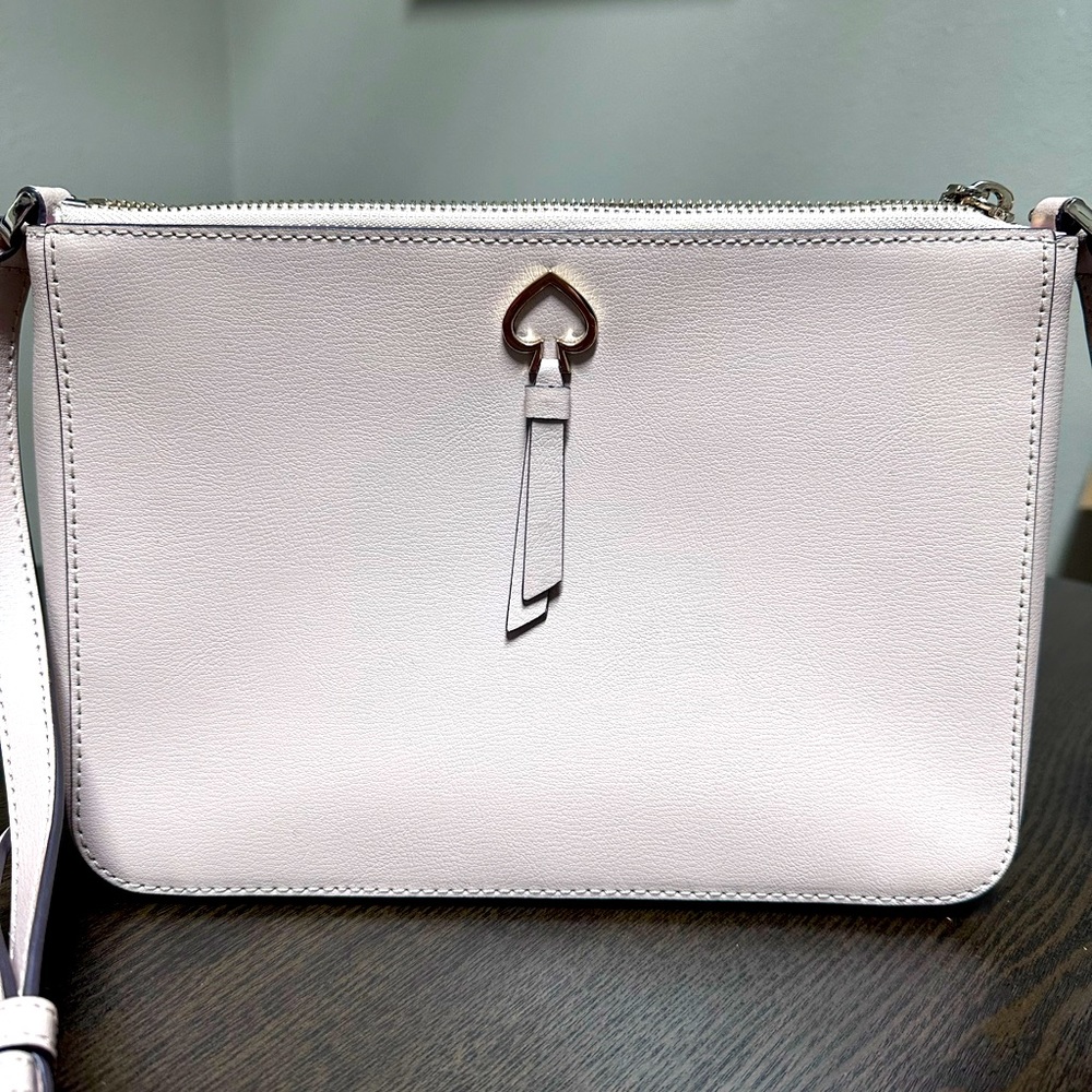Mauve light pink Kate Spade purse maybe used twice.